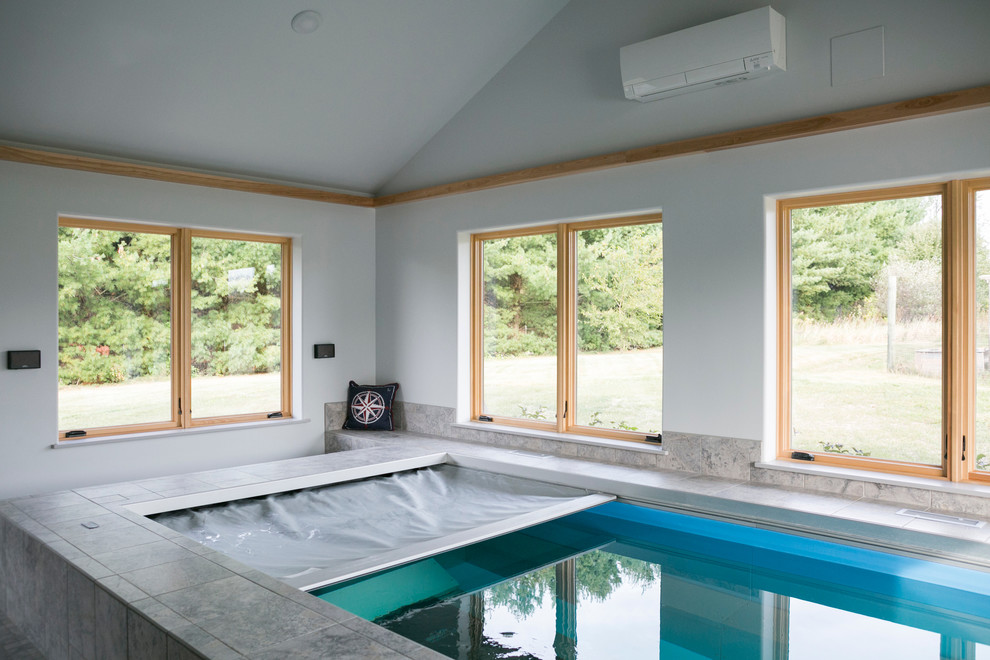 Inspiration for a mid-sized transitional indoor tile and rectangular lap pool house remodel