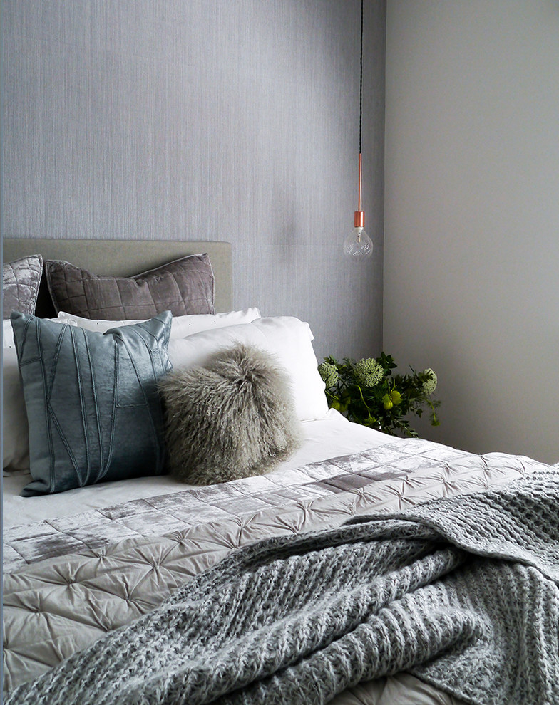 This is an example of a small scandinavian bedroom in Melbourne with medium hardwood floors.