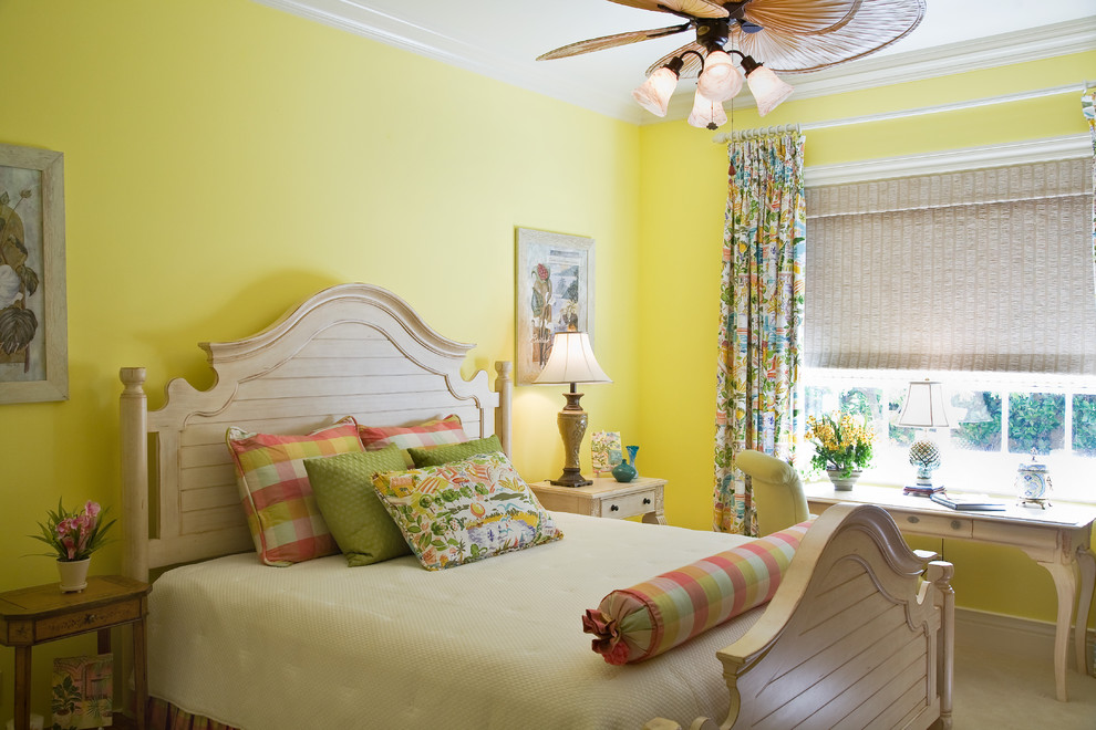 Inspiration for a tropical bedroom in Miami with yellow walls.
