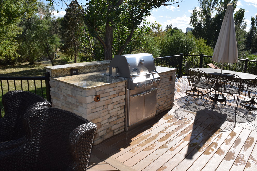 Inspiration for a large arts and crafts backyard deck in Denver with an outdoor kitchen and no cover.
