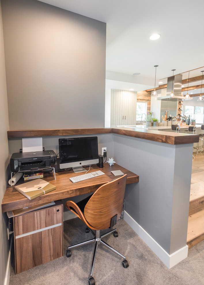 This is an example of a mid-sized modern home office in Boise.