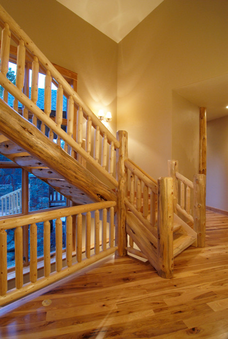Inspiration for a large rustic wooden l-shaped open staircase remodel in Denver