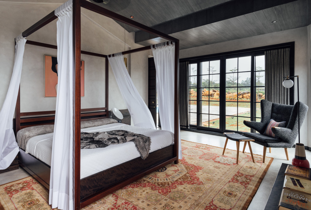 Идея дизайна: хозяйская спальня в стиле ретро с серыми стенами и бетонным полом без камина