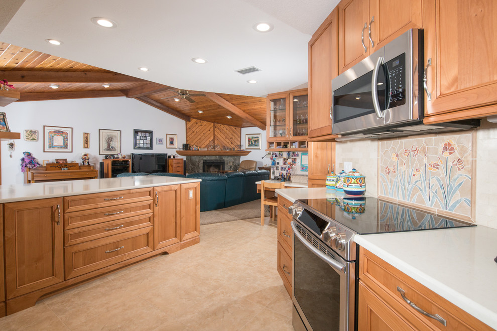 Kitchen - large transitional kitchen idea in Tampa with shaker cabinets, quartz countertops and an island