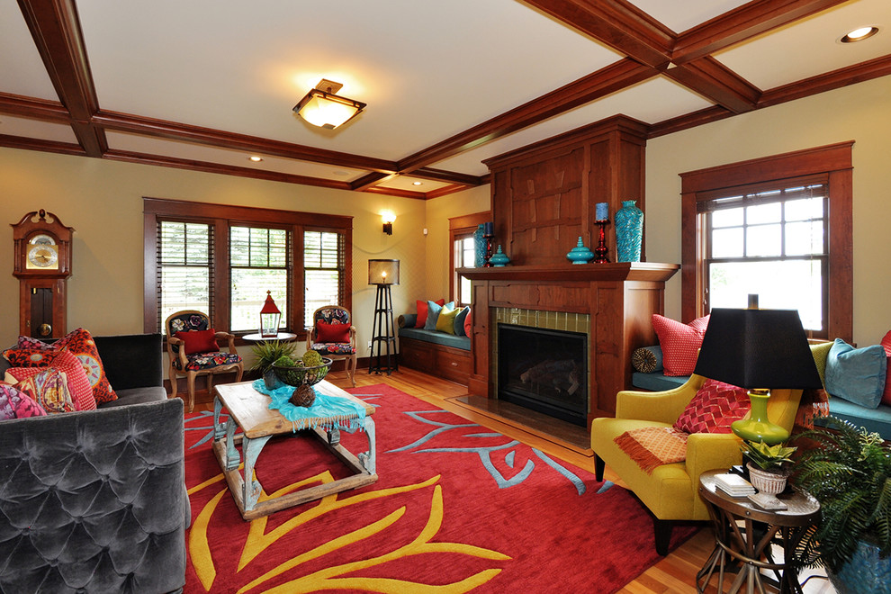 Photo of a mid-sized arts and crafts formal open concept living room in Seattle with beige walls, medium hardwood floors, a wood fireplace surround and a standard fireplace.