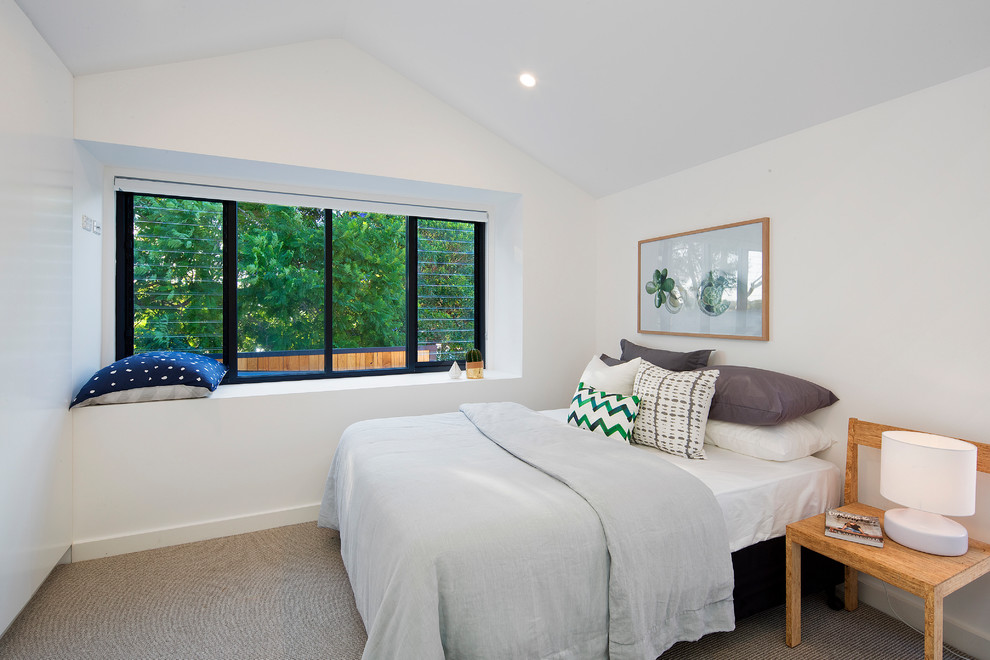 Contemporary guest bedroom in Sydney with white walls, carpet, no fireplace and beige floor.