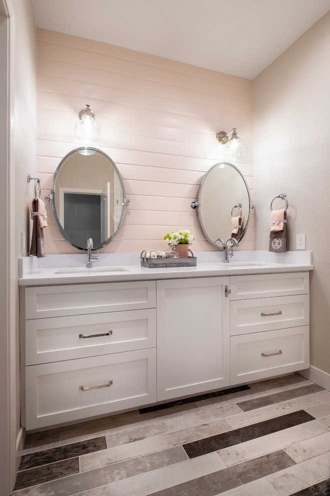 Inspiration for a mid-sized country master vinyl floor and beige floor bathroom remodel in Los Angeles with shaker cabinets, white cabinets, gray walls, an undermount sink, quartz countertops and white countertops