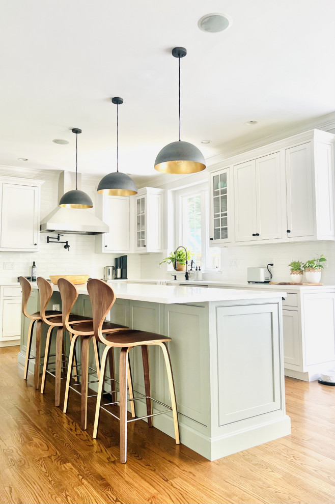 White kitchen with sage island