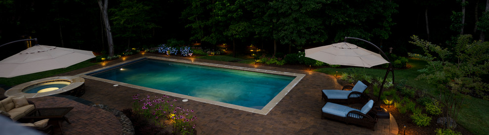 Inspiration for a huge transitional backyard concrete paver and rectangular lap pool fountain remodel in DC Metro