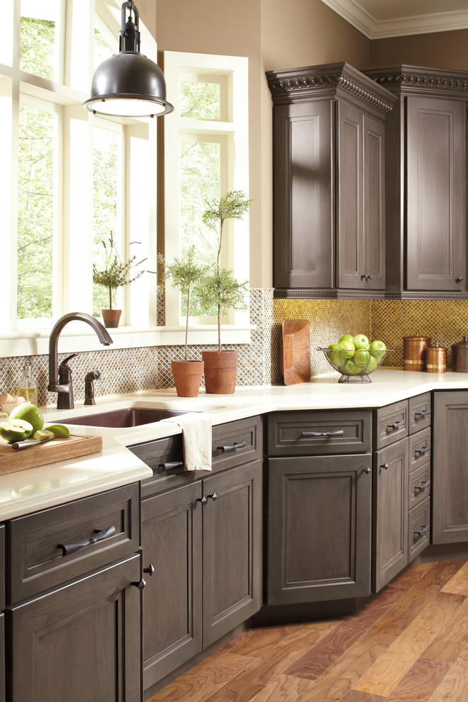 Country kitchen in New York with grey cabinets.