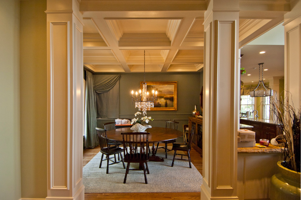 Inspiration for a mid-sized traditional separate dining room in Other with green walls, medium hardwood floors, no fireplace and brown floor.