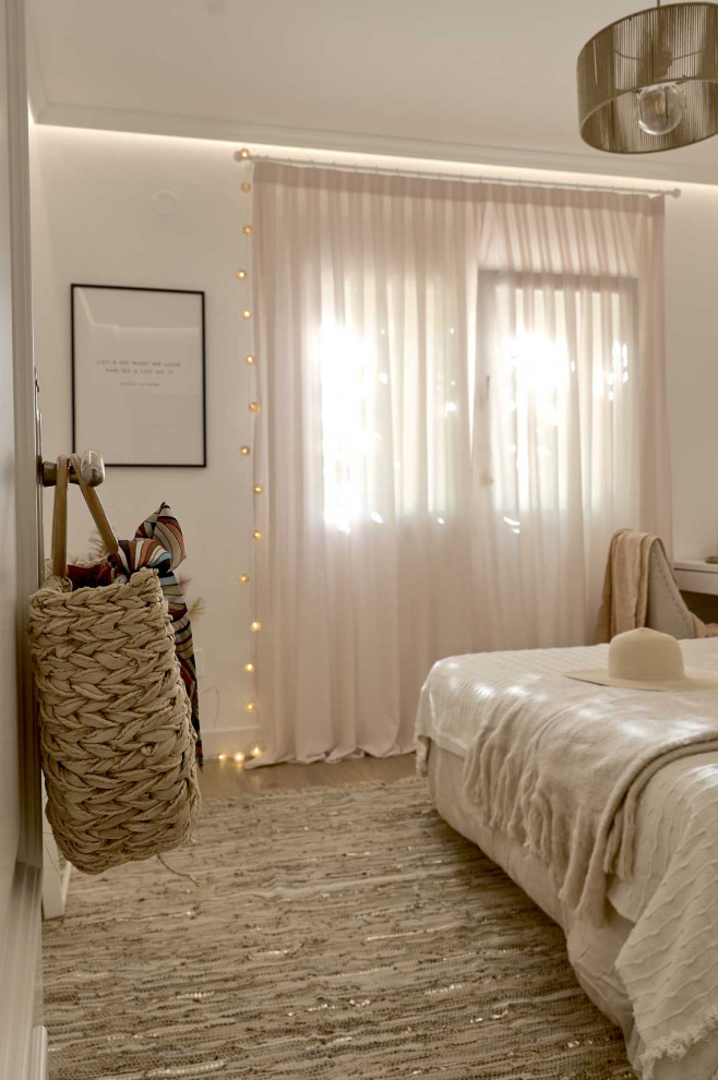 Bedroom - large loft-style medium tone wood floor and brown floor bedroom idea in Alicante-Costa Blanca with white walls