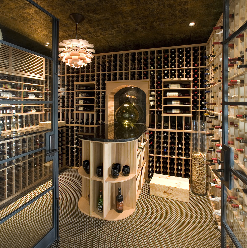 Contemporary wine cellar in Los Angeles with storage racks and multi-coloured floor.