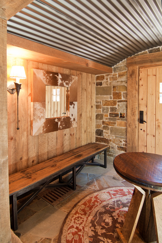 Example of a mountain style single front door design in Sacramento with a light wood front door