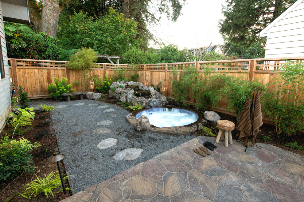 Design ideas for an asian full sun garden in Portland with a water feature and natural stone pavers.