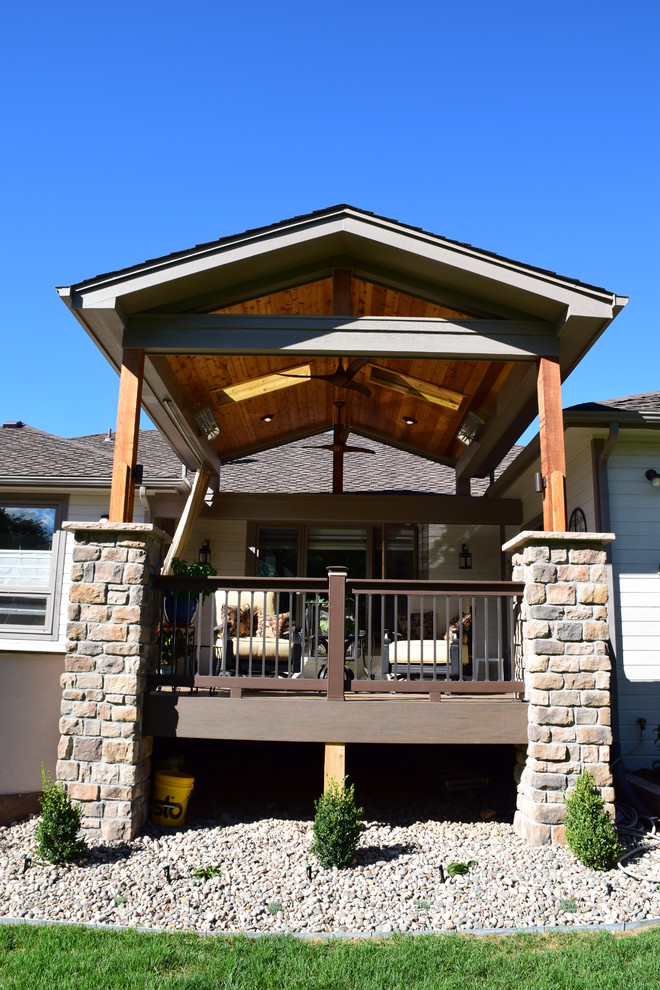 Inspiration for a mid-sized transitional backyard outdoor kitchen deck remodel in Denver with a roof extension