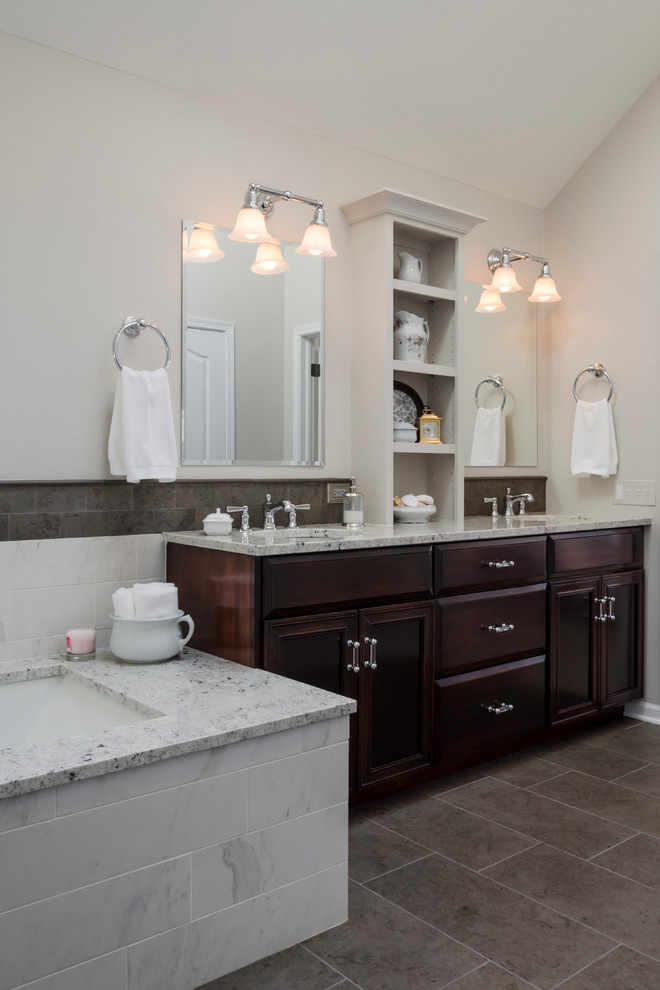 Mid-sized transitional master porcelain tile and beige tile porcelain tile alcove shower photo in Chicago with an undermount sink, flat-panel cabinets, dark wood cabinets, granite countertops, an undermount tub, a two-piece toilet and beige walls