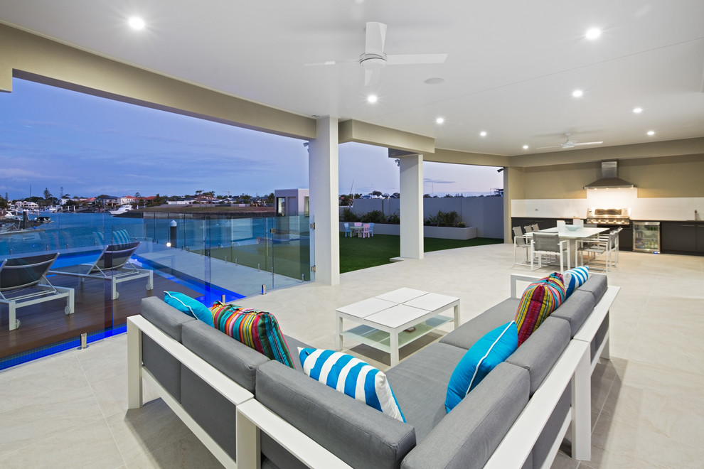 Inspiration for a large contemporary backyard patio in Brisbane with an outdoor kitchen and a roof extension.