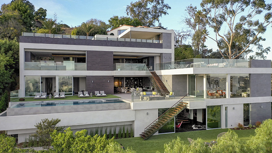 Inspiration for an expansive modern white house exterior in Los Angeles with four or more storeys, mixed siding, a flat roof and a white roof.