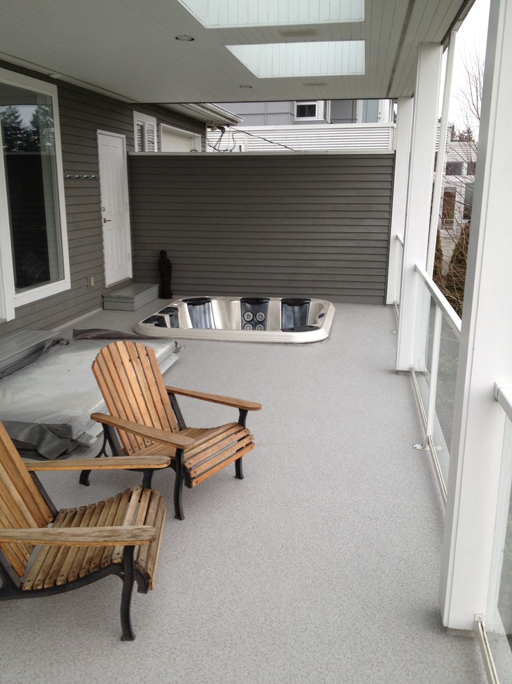 Mid-sized transitional backyard deck photo in Vancouver with a roof extension