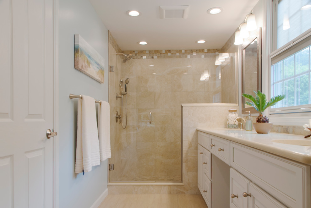 Large beach style master beige tile and porcelain tile porcelain tile, beige floor and double-sink bathroom photo in Other with raised-panel cabinets, white cabinets, a two-piece toilet, blue walls, an undermount sink, quartz countertops, a hinged shower door, beige countertops and a freestanding vanity