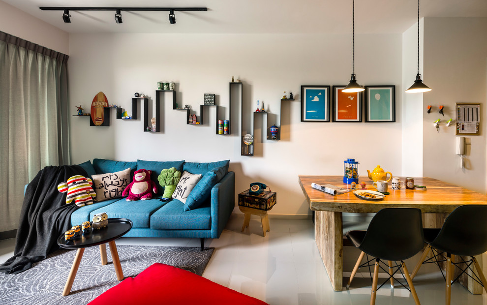 Photo of an eclectic open concept living room in Singapore with white walls and white floor.