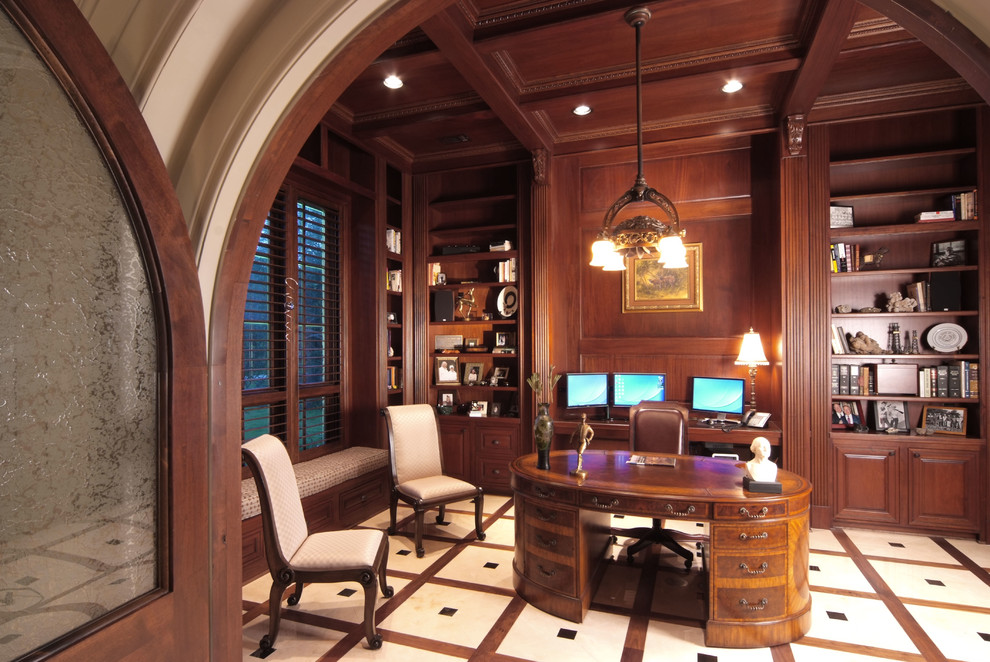 Design ideas for an expansive traditional study room in Houston with brown walls, porcelain floors, no fireplace, a freestanding desk and beige floor.