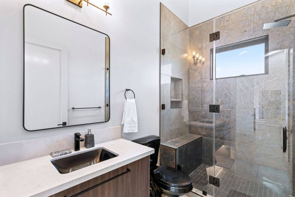 Modern Walk-In Shower with Built-In Bench and Black Fixtures