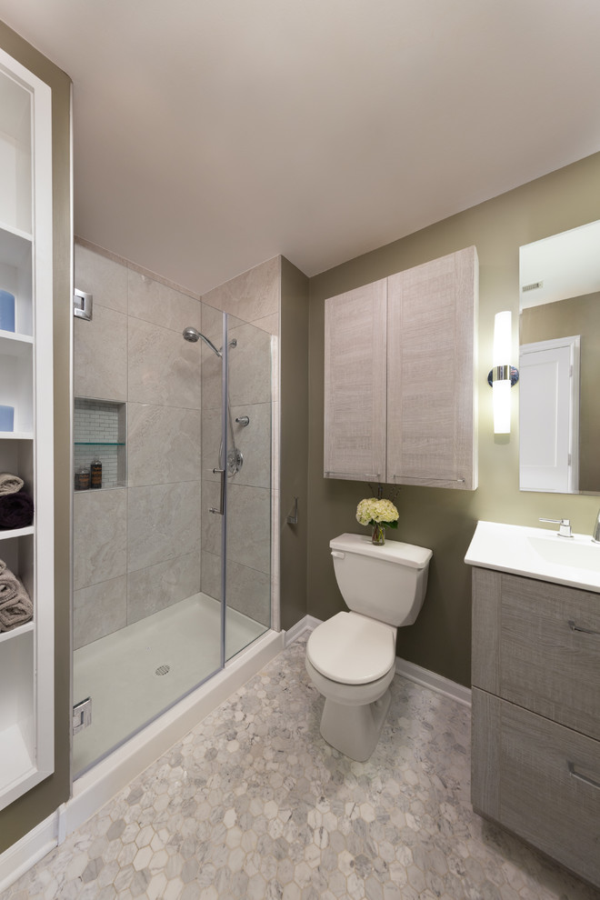 Mid-sized transitional 3/4 bathroom in Chicago with flat-panel cabinets, medium wood cabinets, an alcove shower, a two-piece toilet, gray tile, stone tile, beige walls, an integrated sink, marble benchtops and mosaic tile floors.
