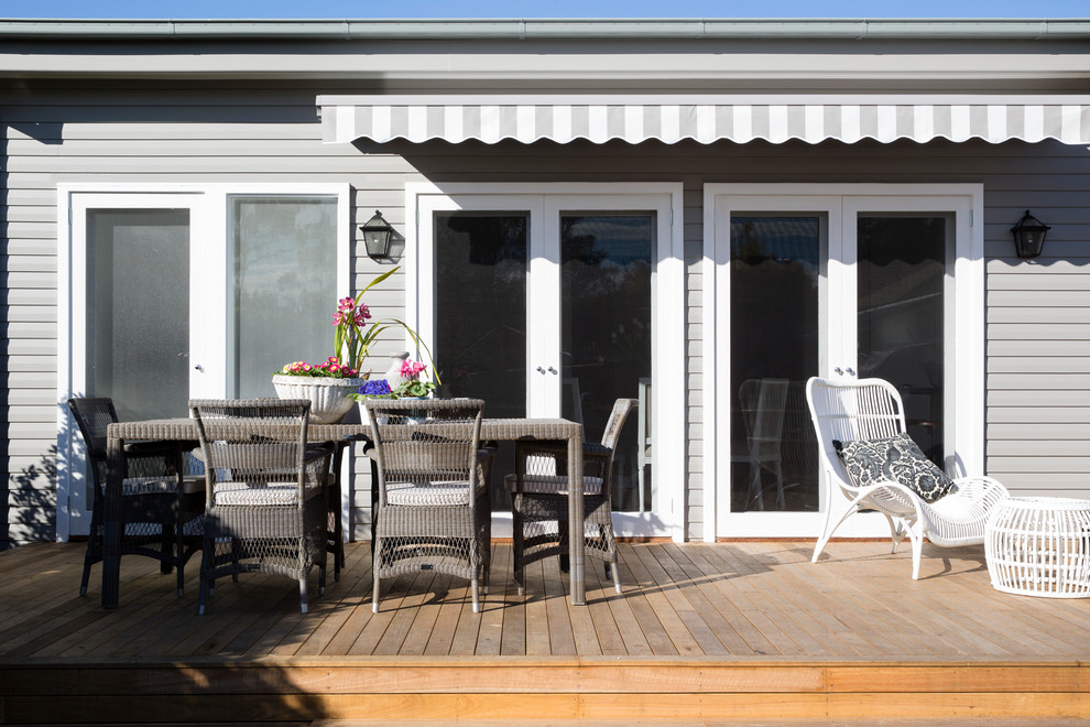 Inspiration for a mid-sized transitional deck in Sydney with an awning.