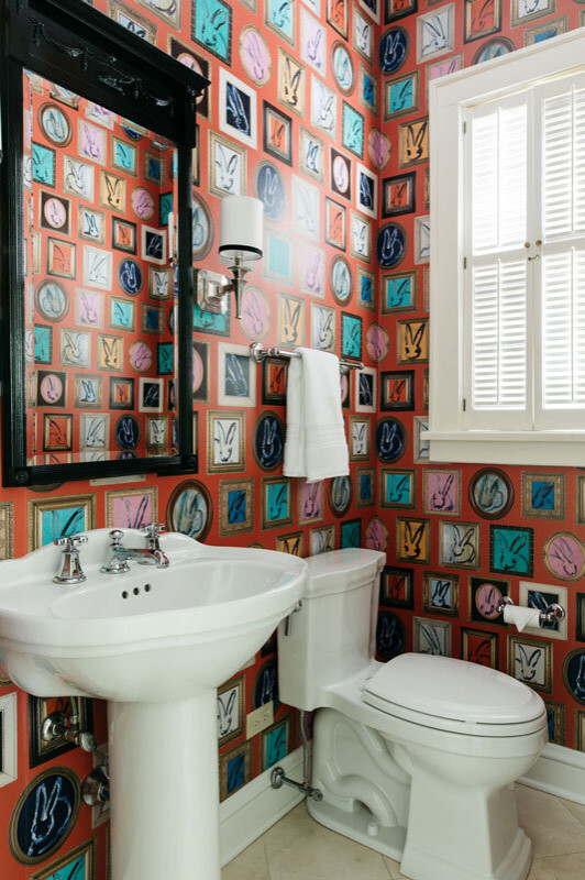 This is an example of a small eclectic powder room in Chicago with multi-coloured walls, ceramic floors, a pedestal sink, beige floor and wallpaper.