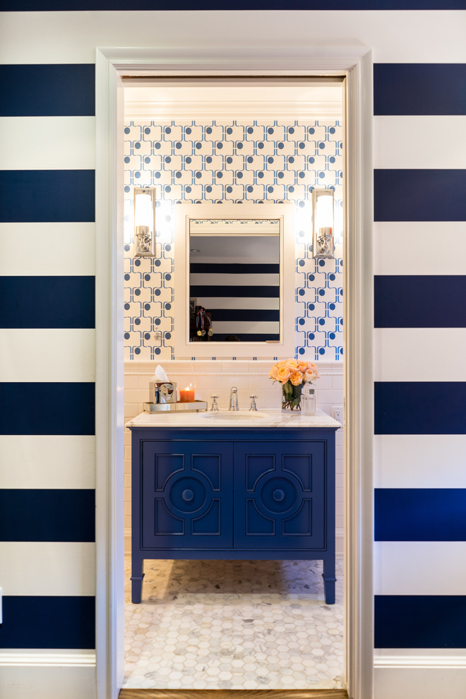 Mid-sized eclectic 3/4 bathroom in San Francisco with furniture-like cabinets, blue cabinets, white tile, ceramic tile, blue walls, marble floors, an undermount sink, marble benchtops and grey floor.