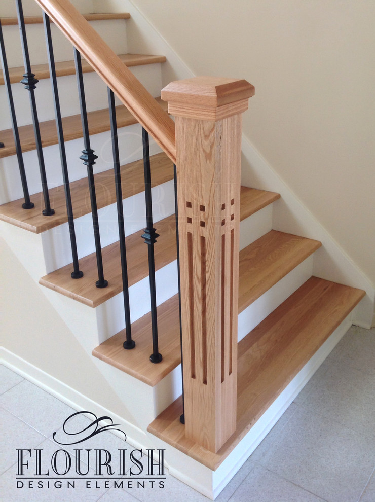 Design ideas for a large contemporary wood staircase in Montreal with painted wood risers.