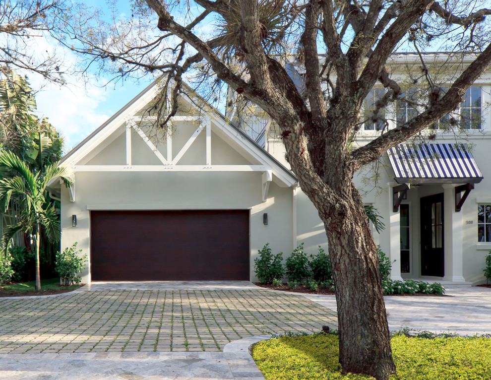 Design ideas for a mid-sized transitional attached one-car garage in Miami.