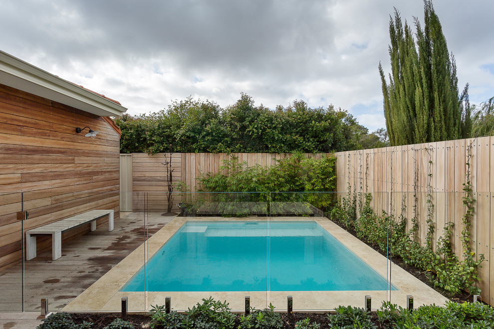 Small backyard rectangular pool in Perth with decking.