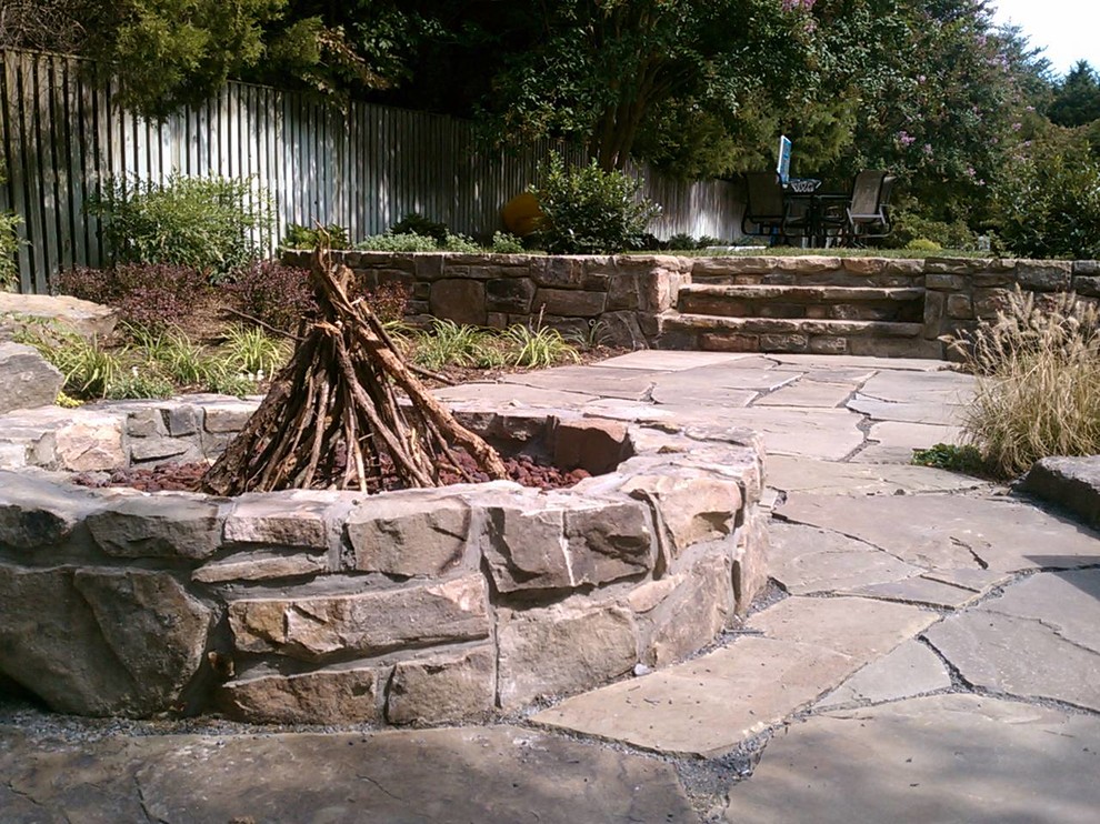This is an example of a rustic landscaping in DC Metro with a fire pit.