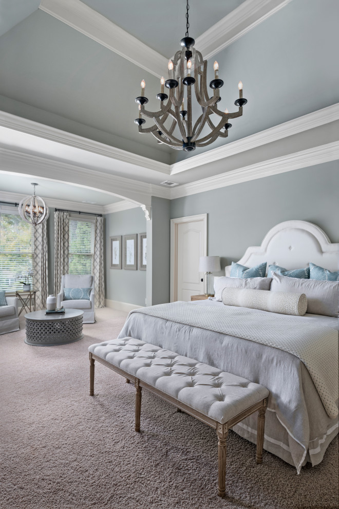 This is an example of a large mediterranean master bedroom in Atlanta with carpet, grey floor and grey walls.