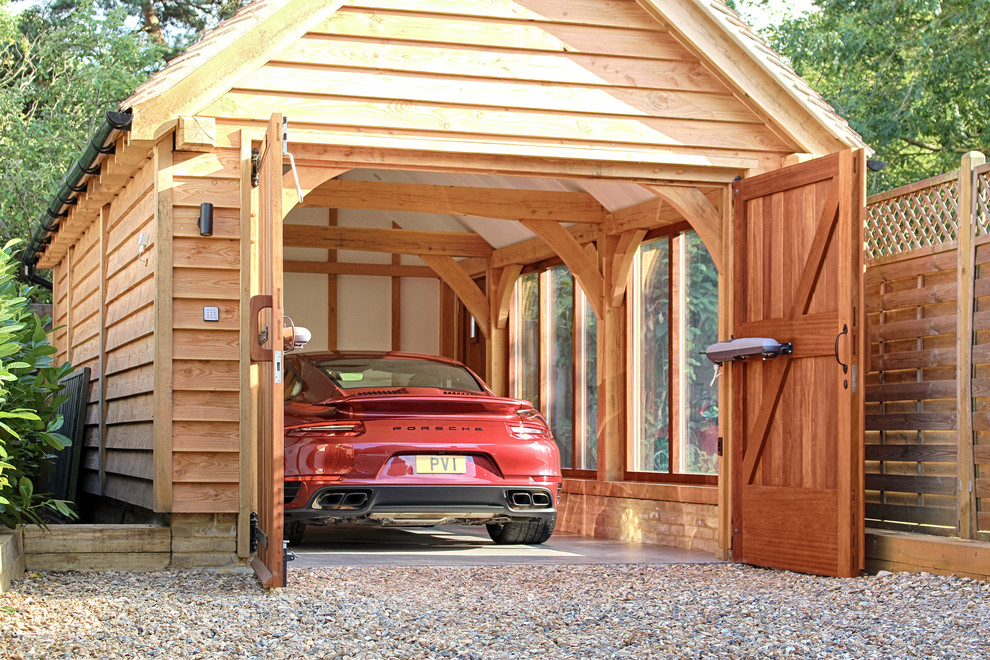 Inspiration for a mid-sized traditional detached one-car garage.
