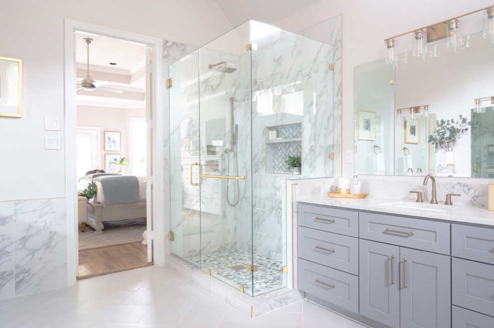 Inspiration for a transitional bathroom in Dallas with shaker cabinets, grey cabinets, a corner shower, white tile, white walls, an undermount sink, grey floor, a hinged shower door, white benchtops, a single vanity, a built-in vanity and vaulted.