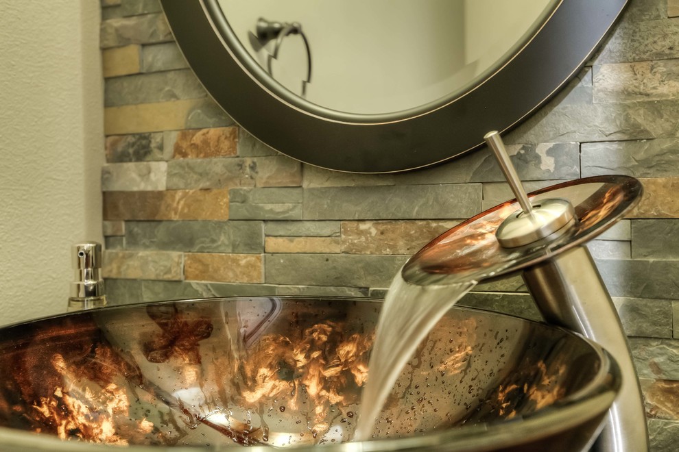 Bathroom in Portland with a vessel sink, multi-coloured tile and stone tile.