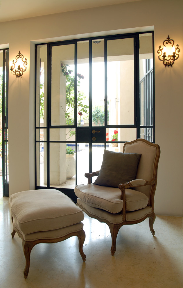 This is an example of a mediterranean family room in Tel Aviv with beige walls.
