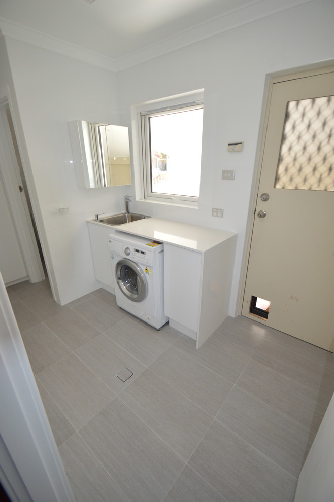 Photo of a contemporary laundry room in Perth.