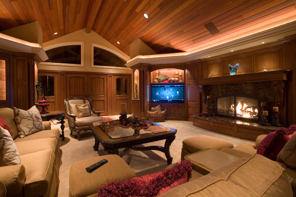 Inspiration for a large traditional open concept home theatre in Other with a built-in media wall, brown walls, carpet and beige floor.