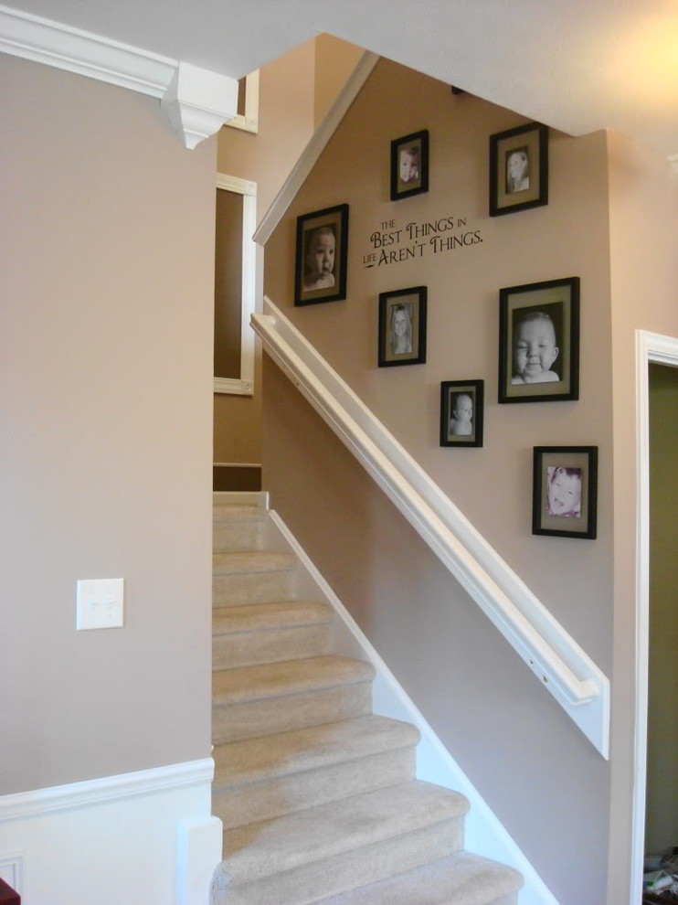 Staircase - contemporary carpeted staircase idea in Indianapolis with carpeted risers