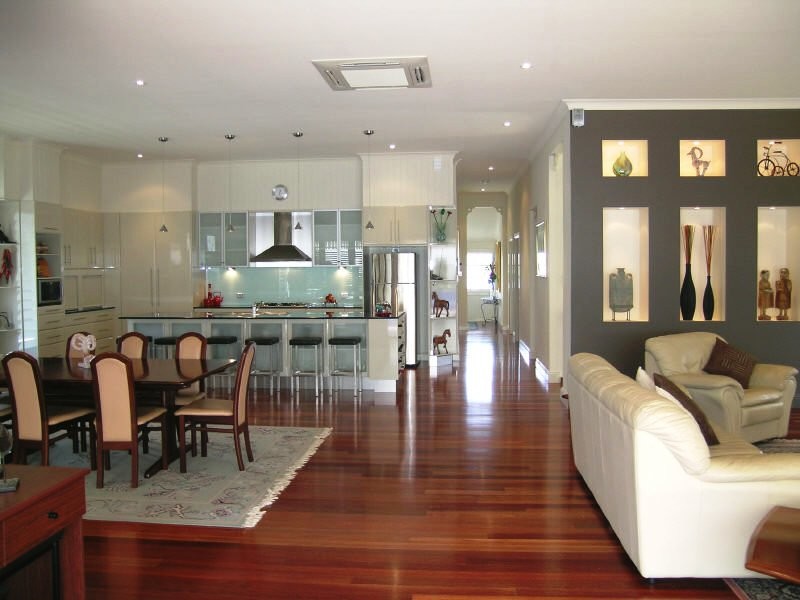 Design ideas for a traditional kitchen/dining combo in Brisbane with medium hardwood floors.