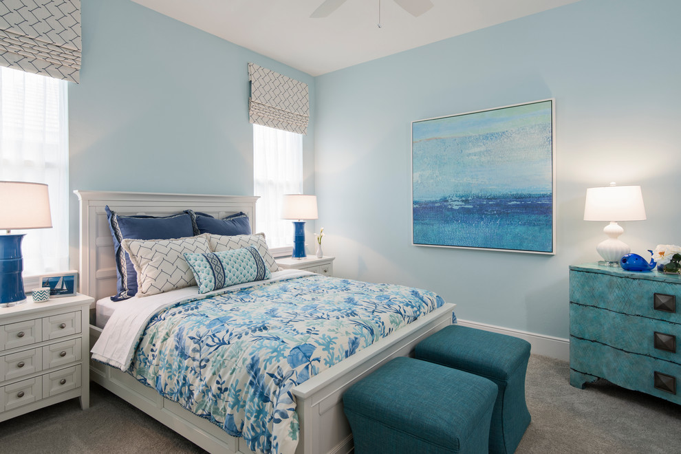 Inspiration for a beach style guest bedroom in Miami with blue walls, carpet and grey floor.