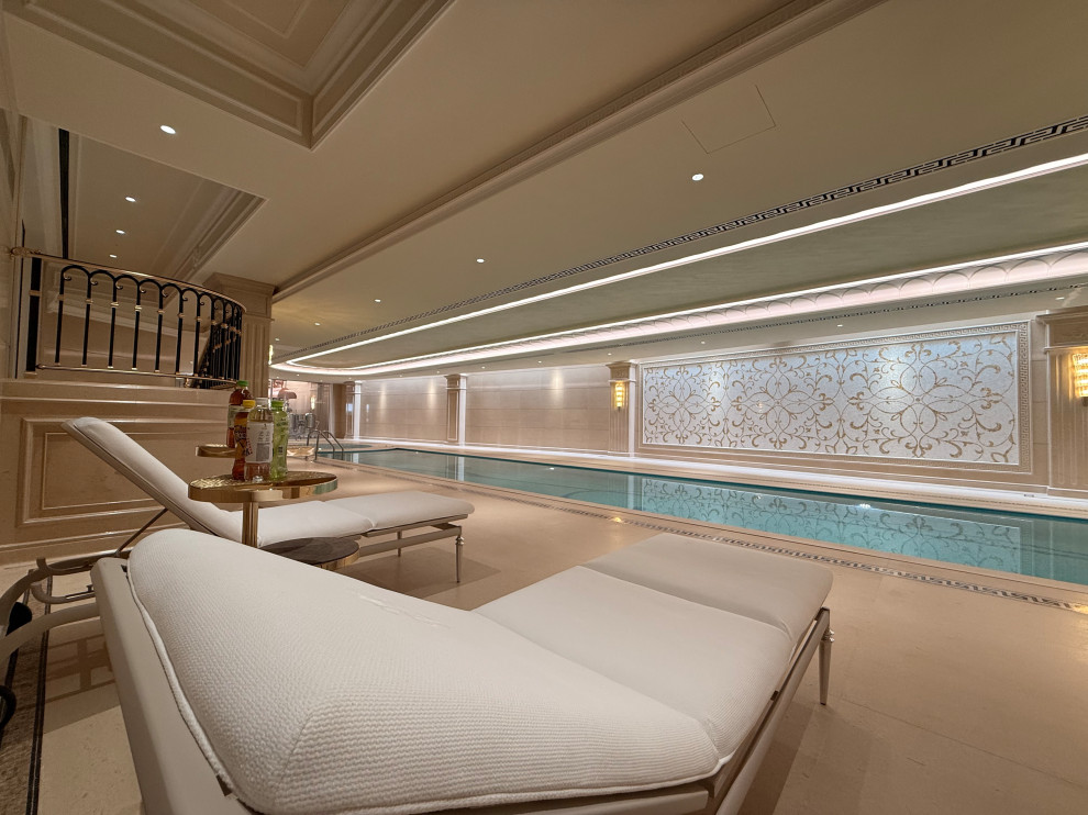 Huge transitional indoor tile and custom-shaped lap pool photo