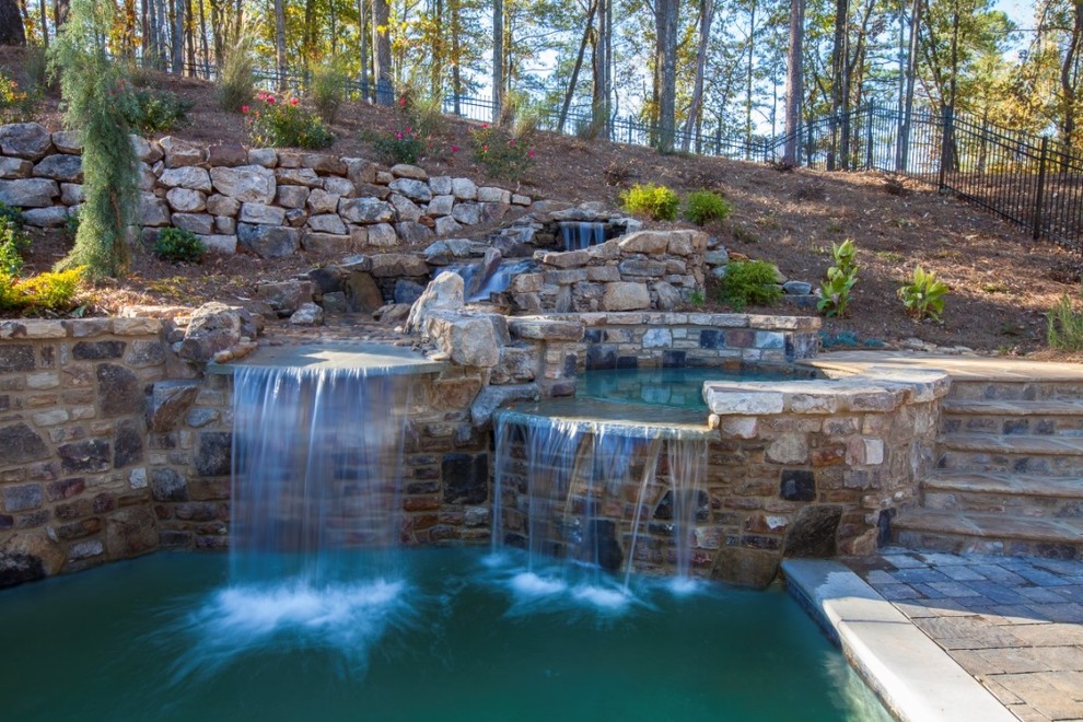 Inspiration for a contemporary backyard pool in Atlanta with a hot tub and natural stone pavers.