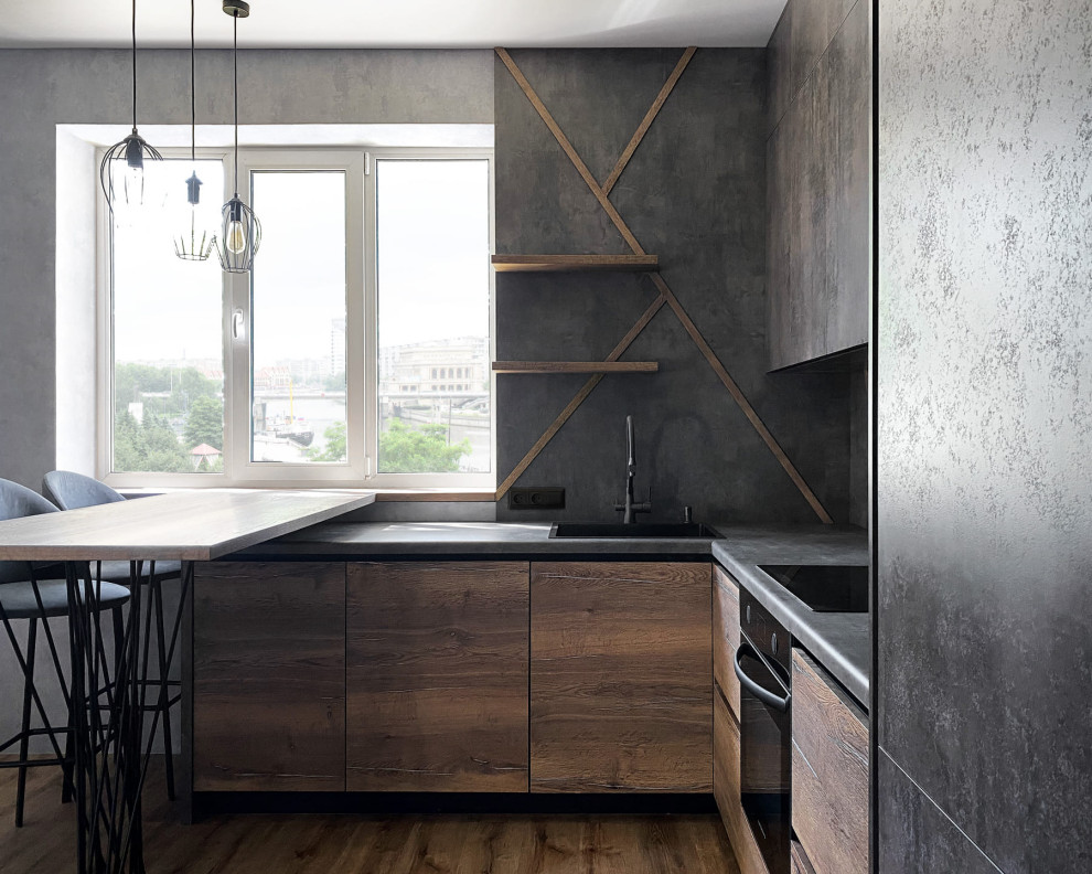 Photo of a medium sized industrial l-shaped enclosed kitchen in Other with a built-in sink, raised-panel cabinets, grey cabinets, wood worktops, grey splashback, wood splashback, stainless steel appliances, laminate floors, a breakfast bar, brown floors and brown worktops.