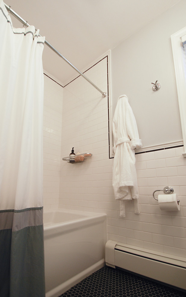 Inspiration for a mid-sized transitional 3/4 bathroom in New York with a shower/bathtub combo, black tile, black and white tile, white tile, subway tile, grey walls, ceramic floors, black cabinets, open cabinets, a one-piece toilet, an integrated sink, an alcove tub, engineered quartz benchtops, black floor and a shower curtain.